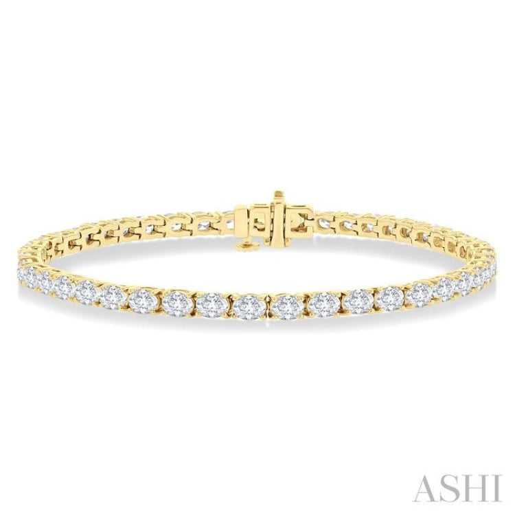 5 1/2 Ctw East West Oval Cut Diamond Fashion Tennis bracelet in 14K Yellow Gold