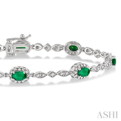 5x3 MM Oval Cut Emerald and 1/20 Ctw Round Cut Diamond Bracelet in 10K White Gold