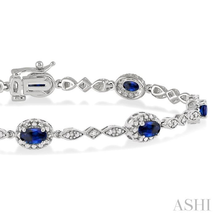5x3 MM Oval Cut Sapphire and 1/20 Ctw Round Cut Diamond Bracelet in 10K White Gold
