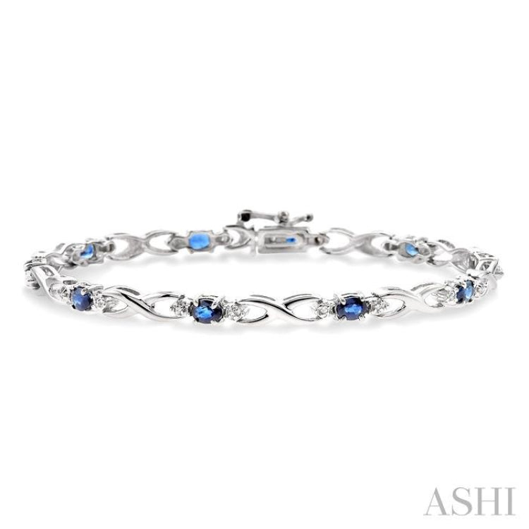 4x3 MM Oval Cut Sapphire and 1/10 Ctw Round Cut Diamond Bracelet in 10K White Gold