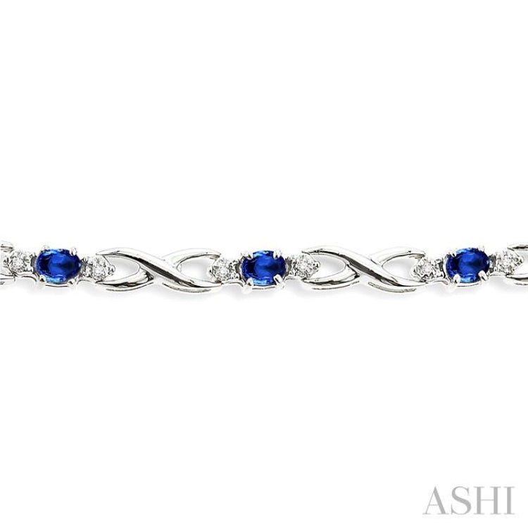 4x3 MM Oval Cut Sapphire and 1/10 Ctw Round Cut Diamond Bracelet in 10K White Gold