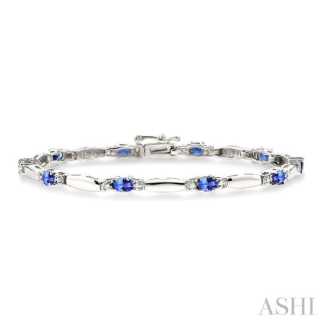 1/10 Ctw Bar and Oval Mount Round Cut Diamond & 5x3MM Oval Cut Tanzanite Precious Bracelet in 10K White Gold