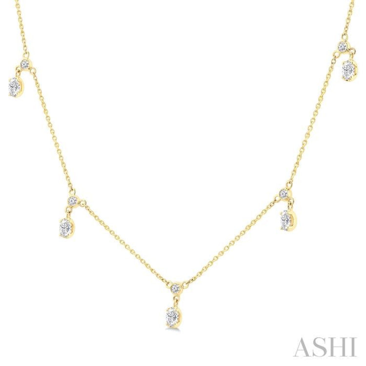 5/8 Ctw Dangle Oval and Round Cut Diamond Station Necklace in 14K Yellow Gold