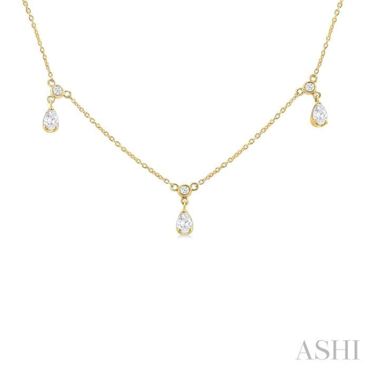 5/8 Ctw Dangle Pear and Round Cut Diamond Station Necklace in 14K Yellow Gold